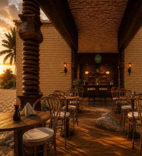 Open-air cafe at sunset with wicker chairs, wooden tables, and a bar in the background under a thatched roof. Palm trees glow in the warm light.