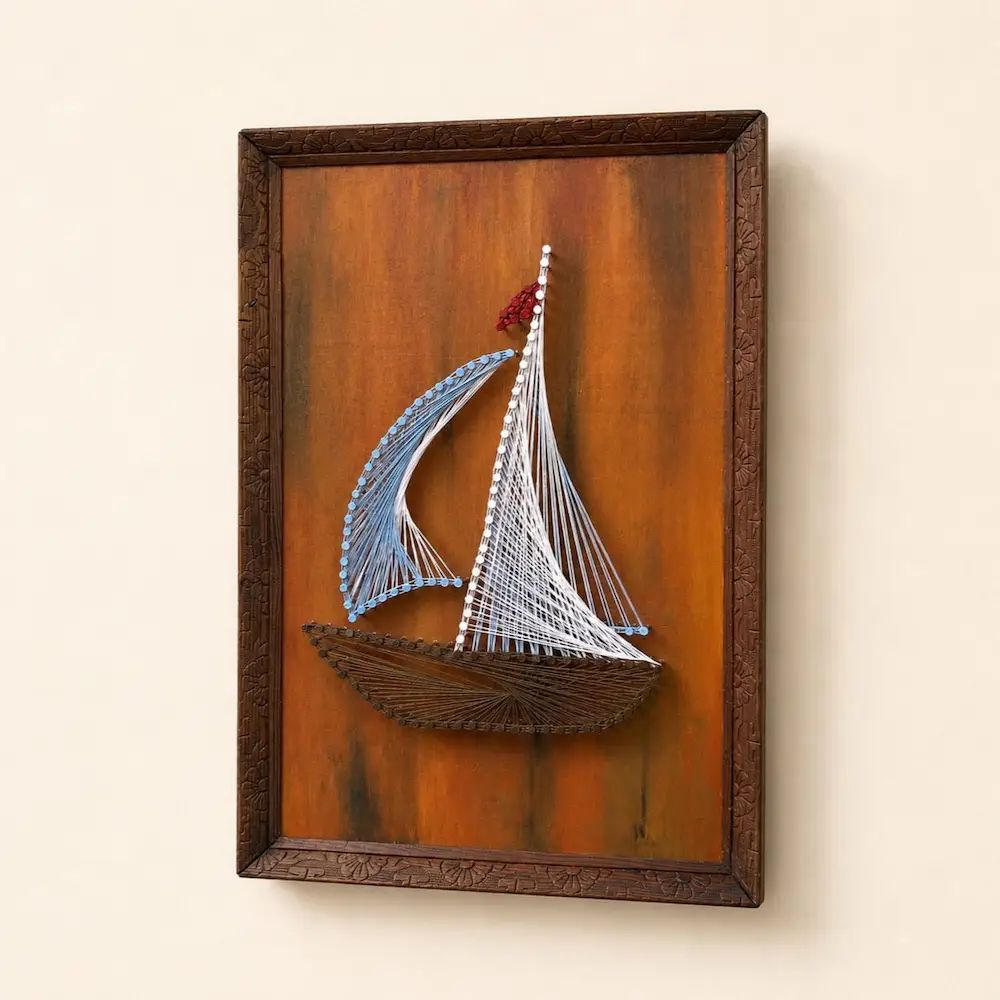 boat string art - Artoza Crafts | Where Craft Becomes Style Framed string-art sailboat with blue and white sails on an orange wood panel
