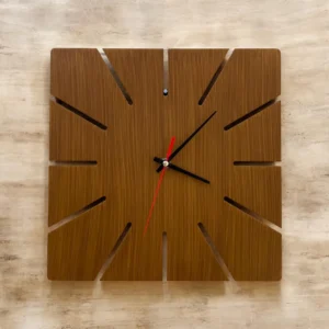 Square wooden wall clock with slotted, cut-out edges and black hour/minute hands plus a red second hand.