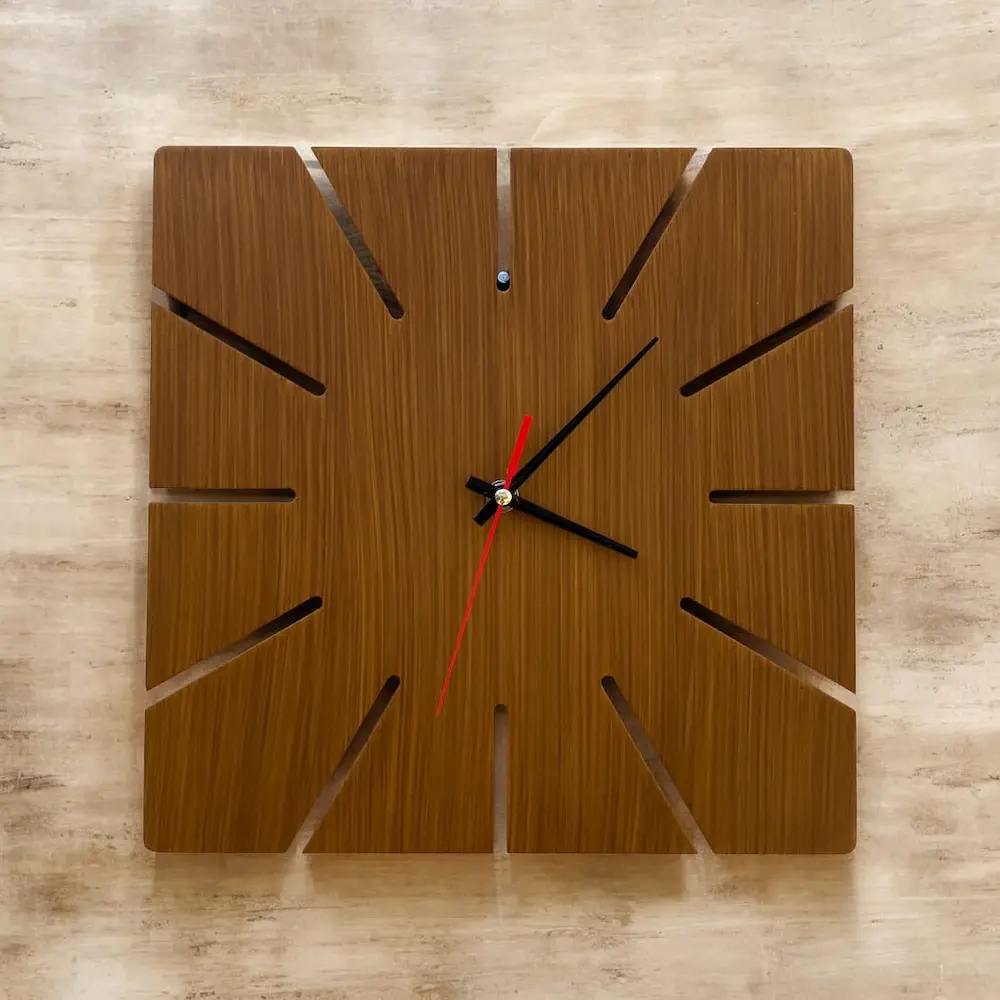 diy cnc clock - Artoza Crafts | Where Craft Becomes Style Square wooden wall clock with slotted, cut-out edges and black hour/minute hands plus a red second hand.