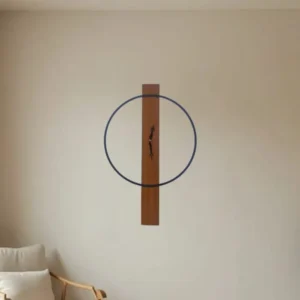 Minimalist wall sculpture: a vertical wooden plank with a blue circular ring around its center on a neutral wall in a living room.