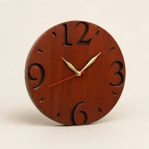 Round wooden wall clock with carved large numerals (12, 3, 6, 9) and gold hands, red second hand, on a light beige background