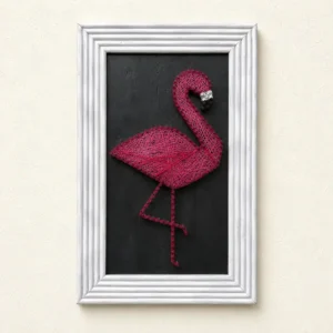 Framed pink string-art flamingo on a black background wall art piece