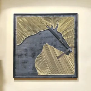 Abstract string art in a black frame: gold thread patterns form two land-like shapes on a dark background, crossed by a diagonal metal bar.