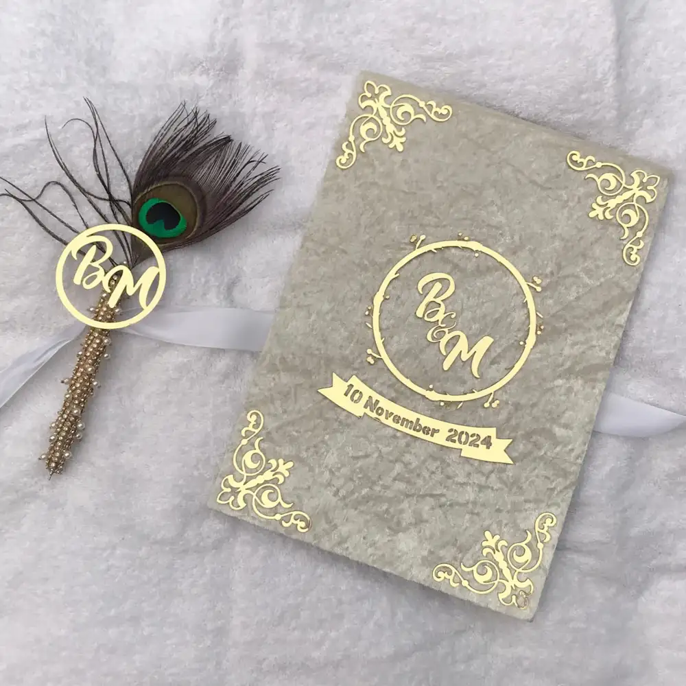 marriage certificate - Artoza Crafts | Where Craft Becomes Style Gray marble wedding invitation with gold corners, circular monogram, and date 10 November 2024, beside a feather quill.