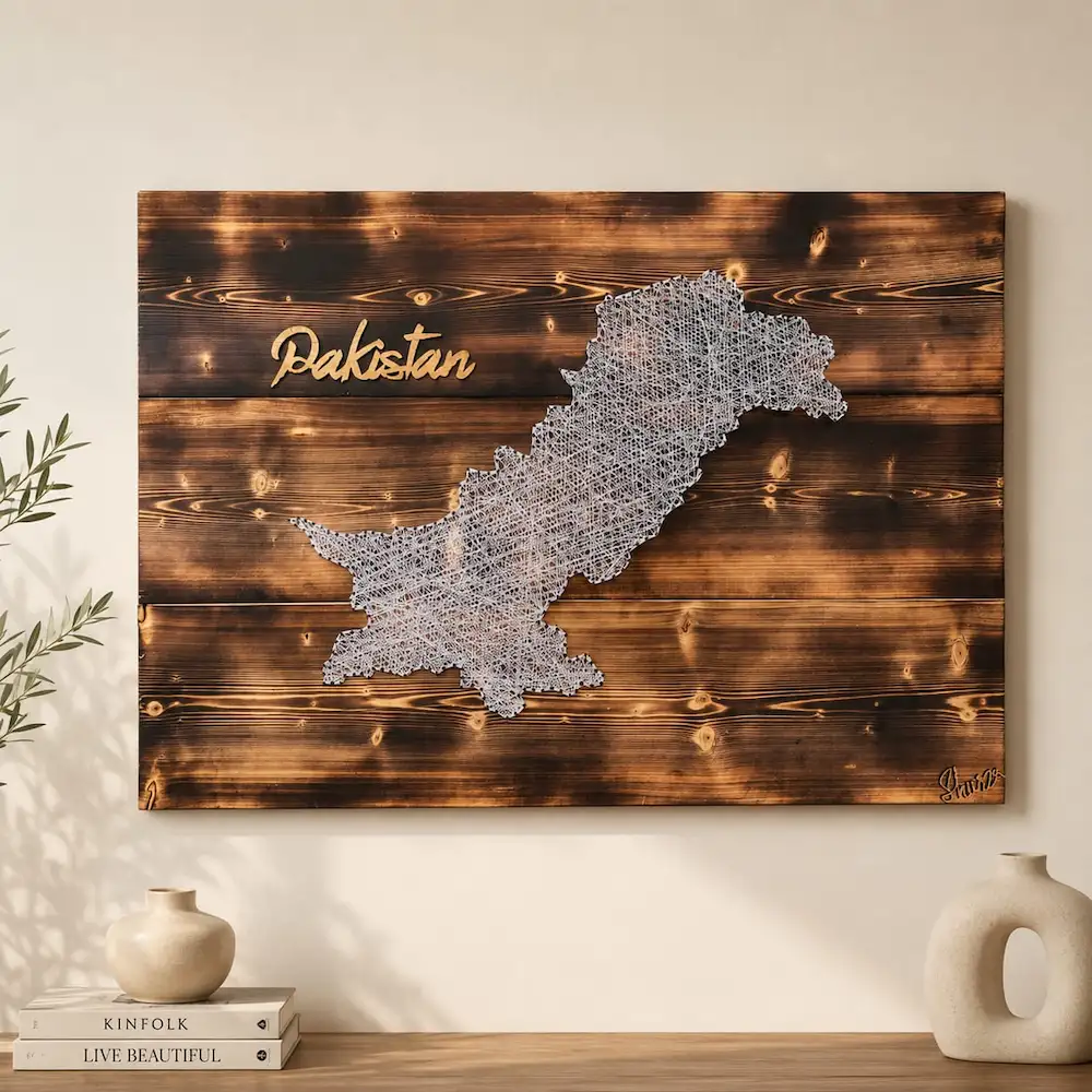 pakistan map string art - Artoza Crafts | Where Craft Becomes Style Wooden wall art showing a white lace-like map of Pakistan with the word Pakistan in gold script on a dark stained background.