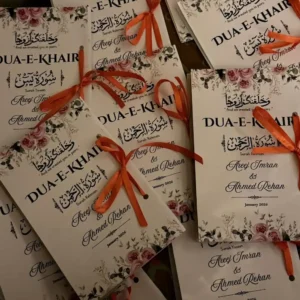 Wedding invitation cards with floral border and orange ribbons, featuring names Areej Imran and Ahmed Rehan, January 2026 (Dua-E-Khair).