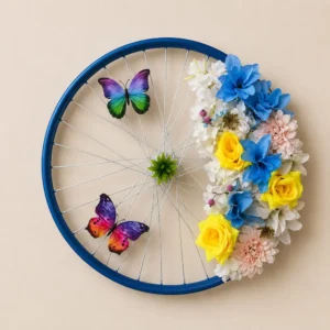 Decorative wall art: a blue bicycle wheel with a floral bouquet and two colorful butterflies on the right side.