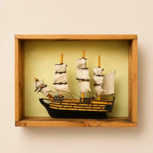 wooden boat - Artoza Crafts | Where Craft Becomes Style Wooden-framed display box holding a miniature sailing ship with three masts and cream sails.