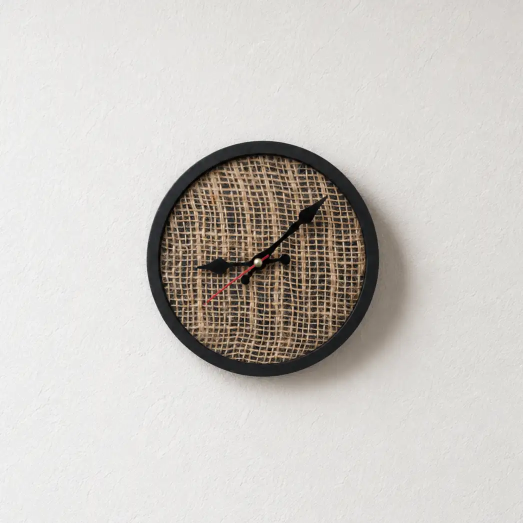 wooden clock - Artoza Crafts | Where Craft Becomes Style Round wall clock with a woven burlap face and black frame; black hour/minute hands and a red second hand stamp the time.